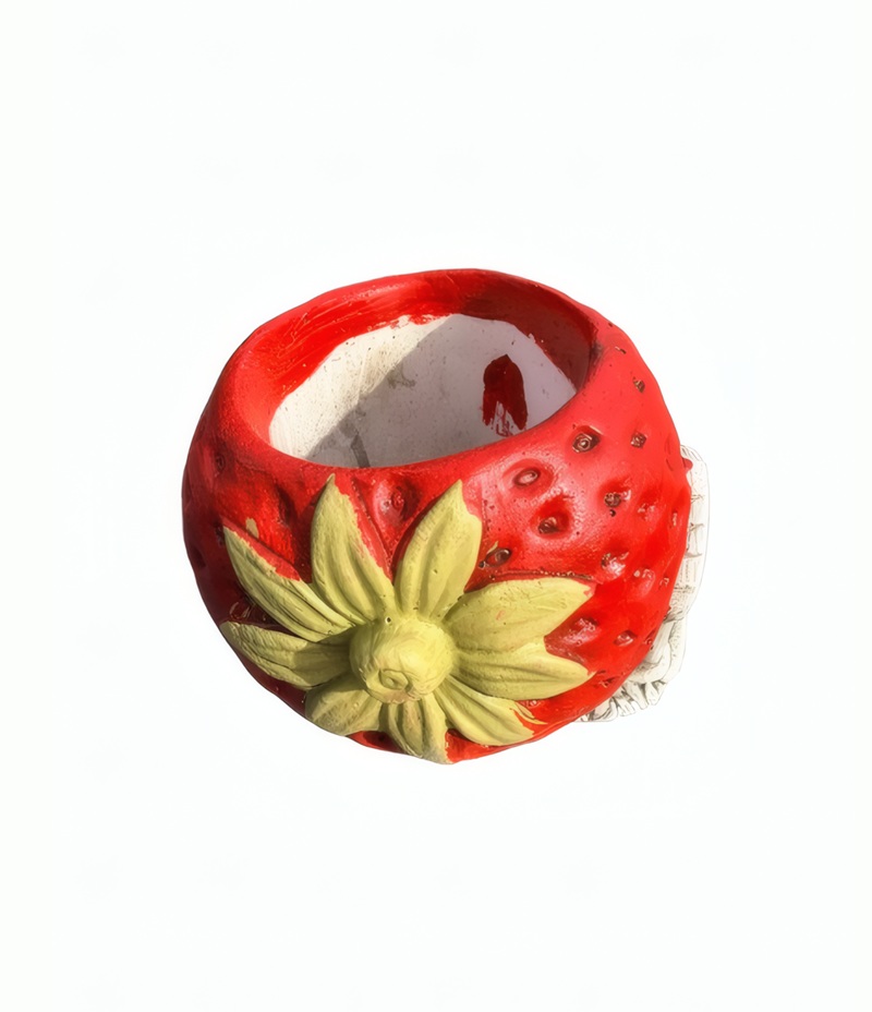 06100000091_2 Parte trasera de Macetero Fresa fabricado en piedra artificial con textura detallada para decoración de plantas en jardín o terraza.