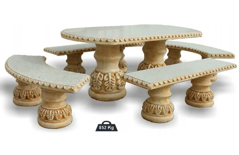 08020200005-1.jpg Conjunto de comedor exterior modelo Hojas Ovalado en color ocre; compuesto por una mesa ovalada de 178 cm y cuatro bancos sin respaldo (dos rectos y dos curvos), fabricados en piedra artificial con relieves ornamentales de hojas en las bases.