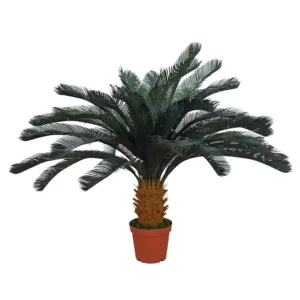 Planta artificial de Cica de 125 cm de altura con un tronco grueso y hojas grandes y rígidas de color verde oscuro, plantada en una maceta redonda de color terracota.